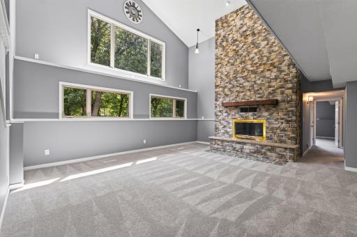Stunning floor to ceiling stone fireplace.