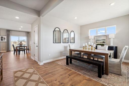 What an entry! This space can be used as a formal dining area, or get creative and use it as a flex space - seating area, office, etc!