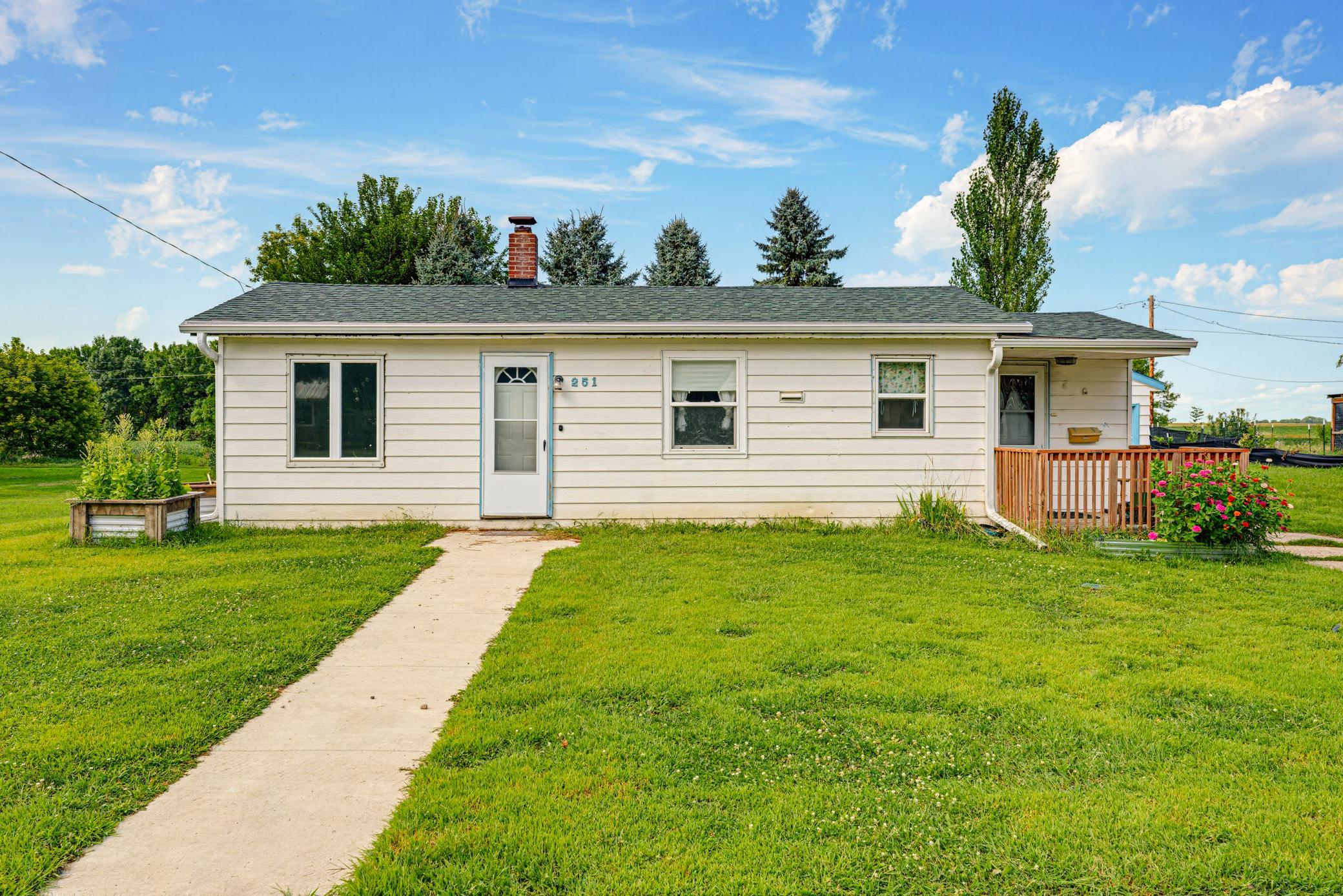 Enjoy relaxing on the 8'x8' deck. The gutters were new in 2023. The shingles were new in 2024.