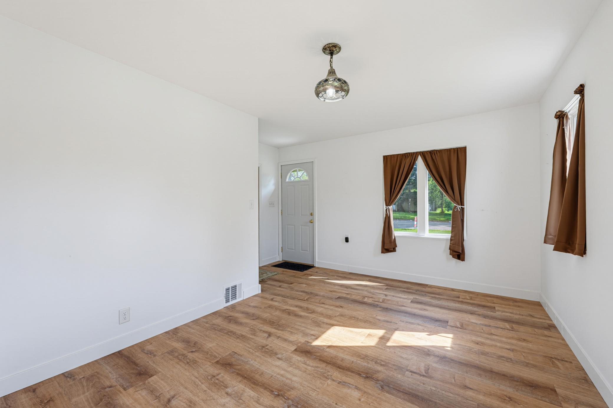 The living room features LVP flooring.