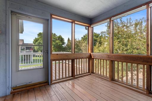 Enjoy the evening sunsets on the south and west facing porch and deck overlooking Windwood Park