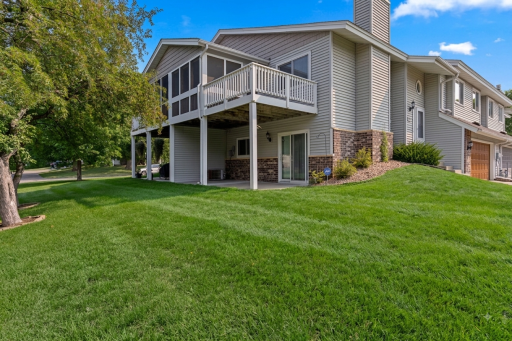 Side elevation is west facing with walkout lower level patio & deck and porch above