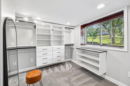 Primary bedroom walk-in closet