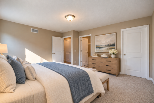 Upper level primary with private bath and walk-in closet.