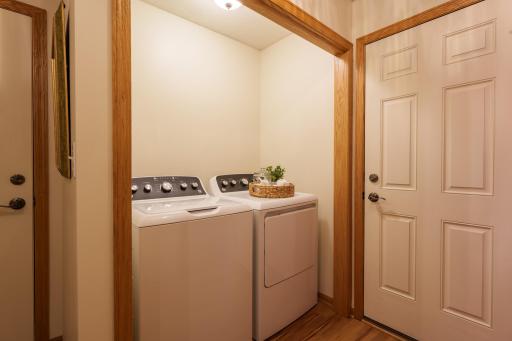 A main-level laundry room and convenient half bath add to the functionality.