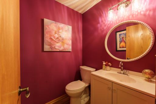 A fun half bathroom on the main level. New vanity, toilet, mirror & lighting in 2026.