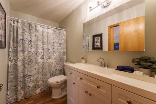 Full bathroom on the upper level. Bathroom updated in 2026 with new vanity, new toilets, new shower head, LVP flooring and light fixtures.