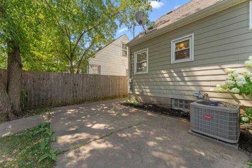 Patio off the back of home offers great space to dine out and relax under the mature trees, and new landscaping ready for you personalization!