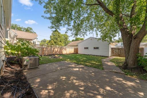 Patio off the back of home offers great space to dine out and relax under the mature trees, and new landscaping ready for you personalization!