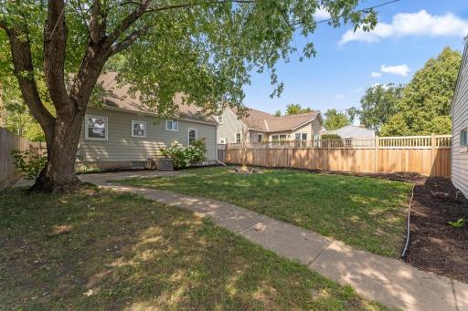 A new cedar fence lines one side of the backyard with lots of space to create your dream back yard entertaining area.
