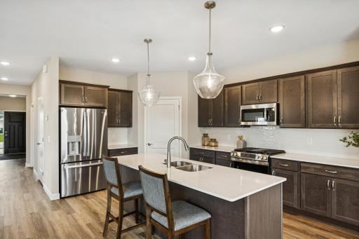 Kitchen - photo is of a previous inventory home. Inquire for more details and options.