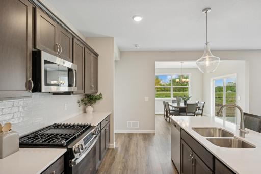 Kitchen - photo is of a previous inventory home. Inquire for more details and options.