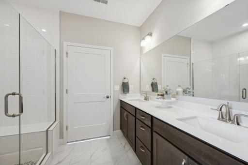 Primary Suite Luxury Bathroom - photo is of a previous inventory home. Inquire for more details and options.