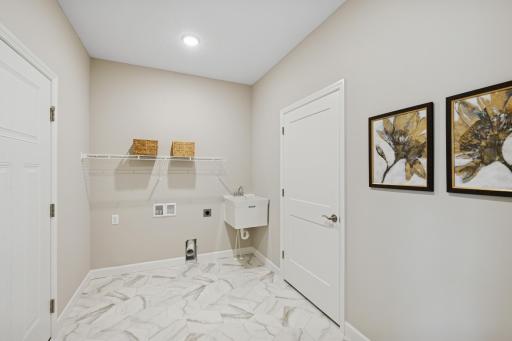 Mud/Laundry Room - photo is of a previous inventory home. Inquire for more details and options.