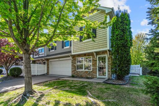 END UNIT townhome on premium lot w/ pond & wetland views in top rated WAYZATA SCHOOLS
