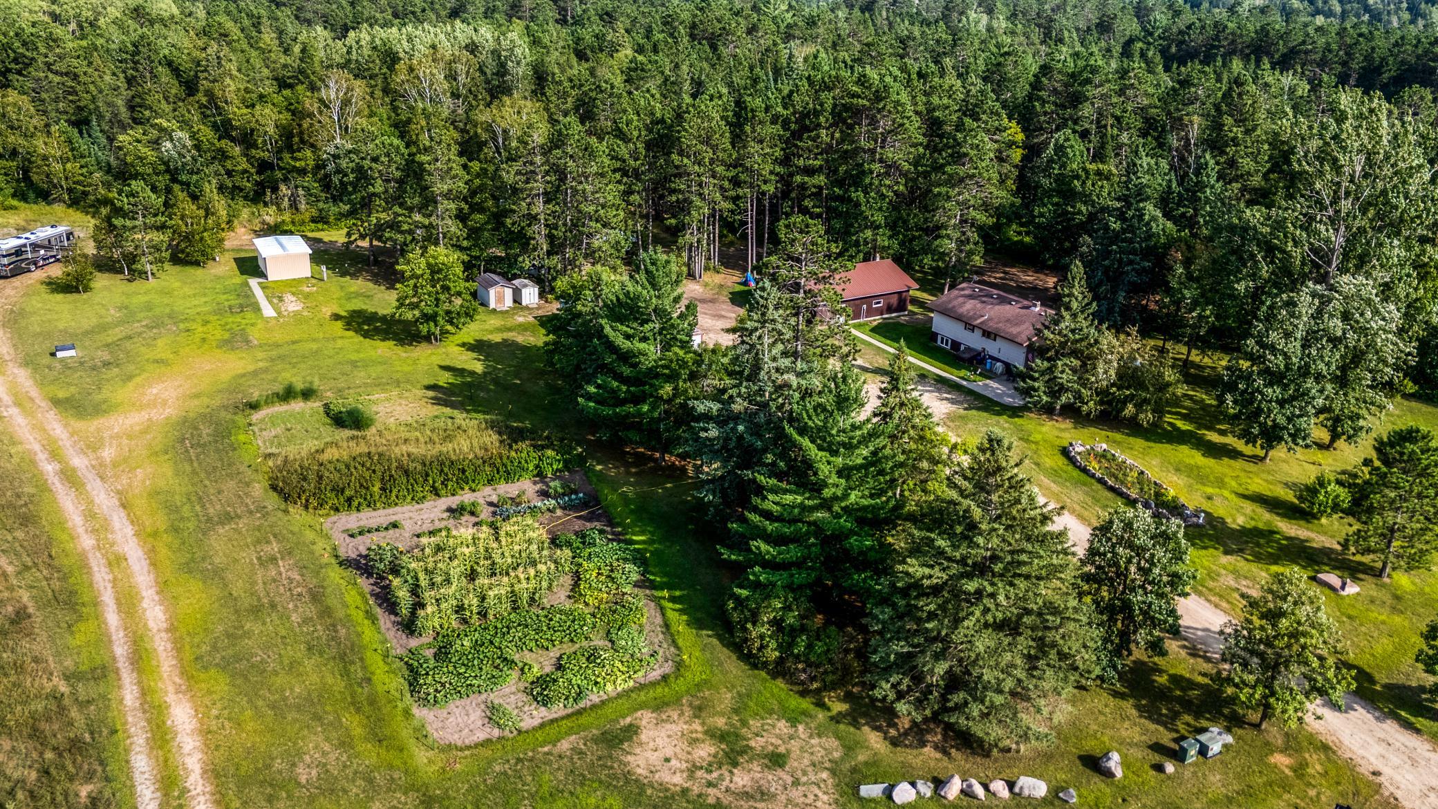 3.67 acres with two large gardens and multiple outbuildings!