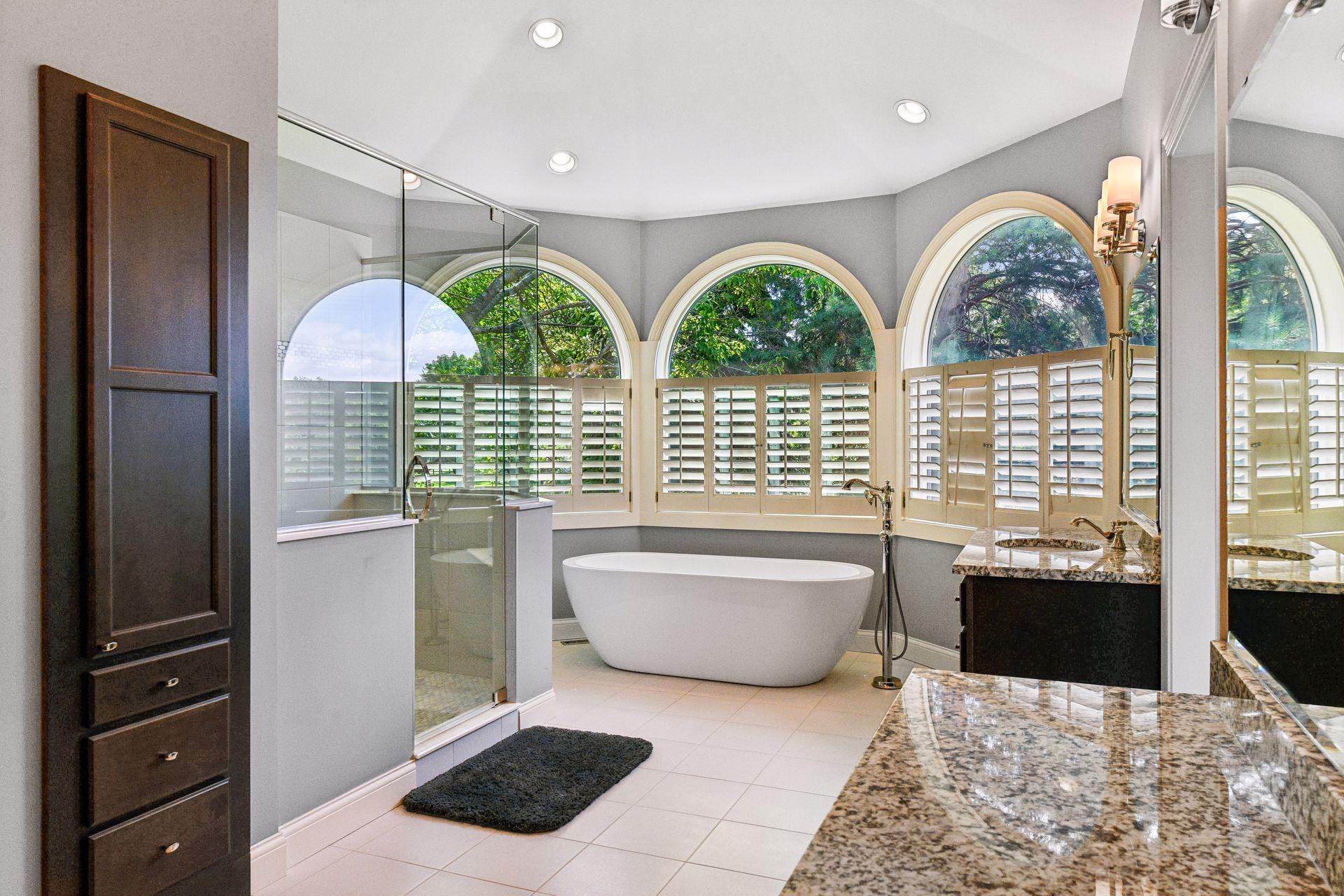 The primary en-suite bathroom with a soaking tub and walk-in shower.