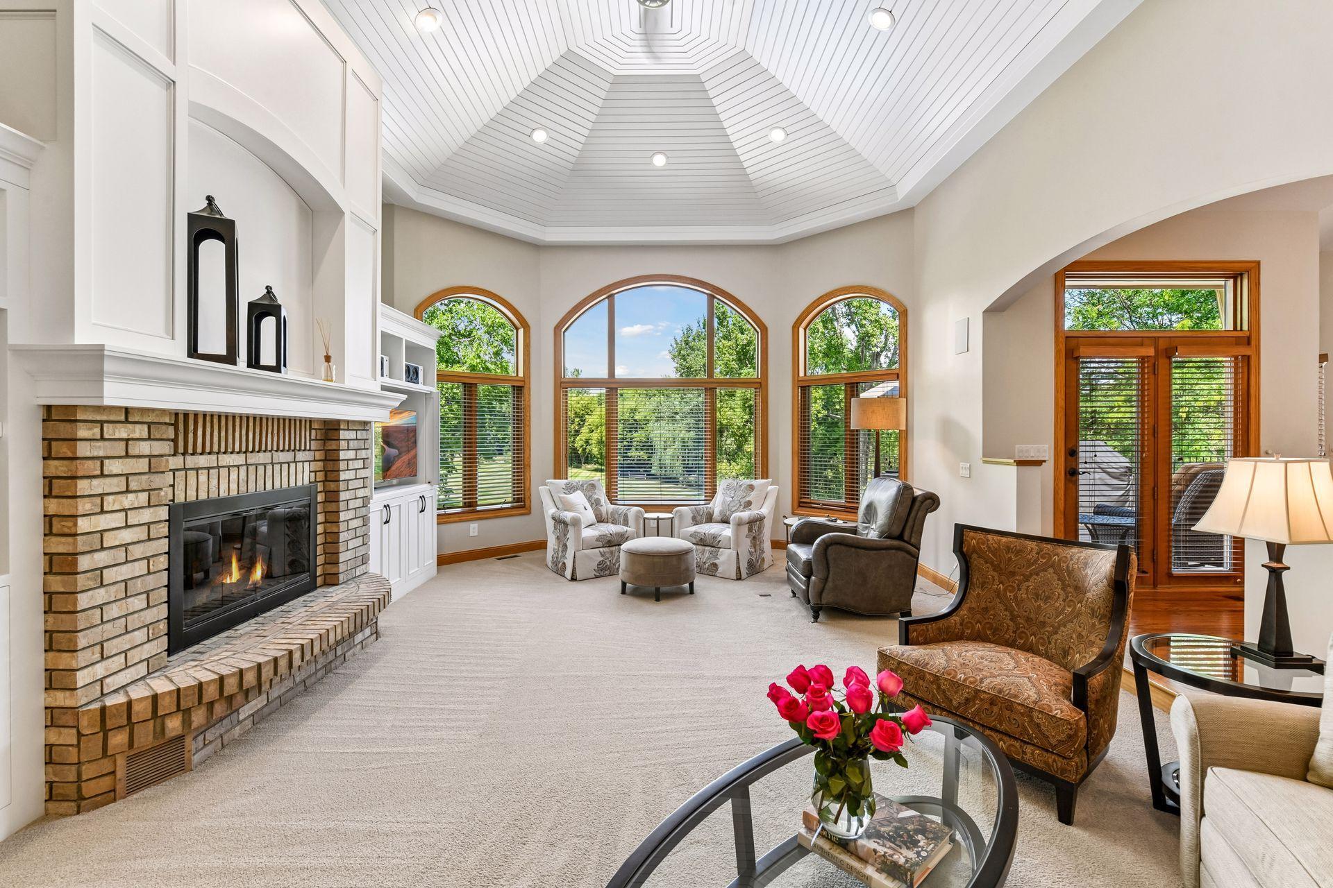 The spacious great room with a cozy gas fireplace and abundant natural light.