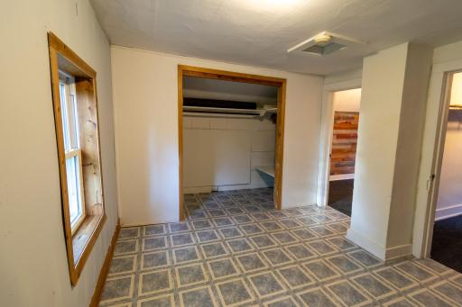 Upper level landing area showing closet space for bedroom