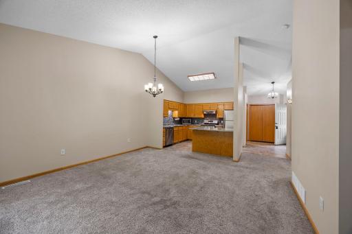 Open floor plan with vaulted ceiling