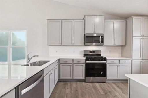 Welcome home to the Rushmore! Well appointed, spacious kitchen! Peninsula for ample seating and so much more!