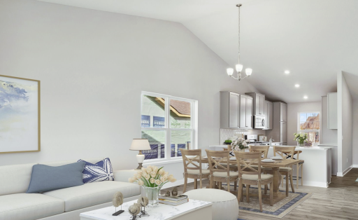 Open main floor layout with soaring vaulted ceilings.