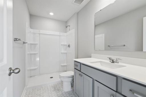 Primary Bath Suite with quartz countertops *Pictures of model home, options may vary.
