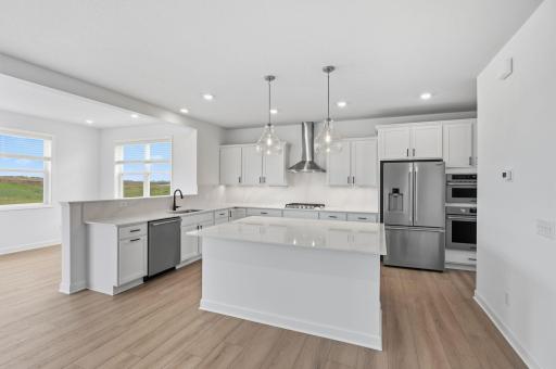 The spacious kitchen naturally serves as the heart of this home, complete with a generous center island, brand-new appliances and a walk-in pantry.