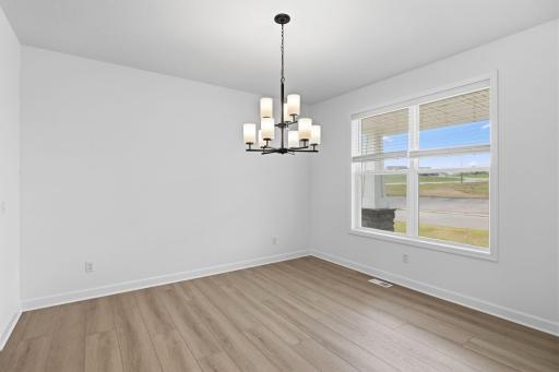 A formal dining room is easily accessed through the kitchen, ideal for dinners with extended family and holiday celebrations with guests.