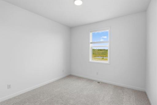The secondary bedrooms provide comfort and privacy.