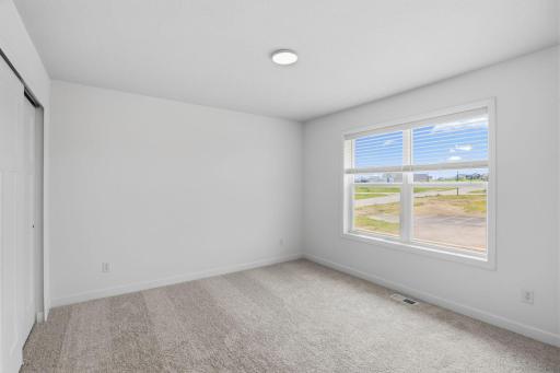 This main level guest suite is sequestered from the rest of the first floor living spaces, creating a quiet environment ideal for overnight guests or remote work.