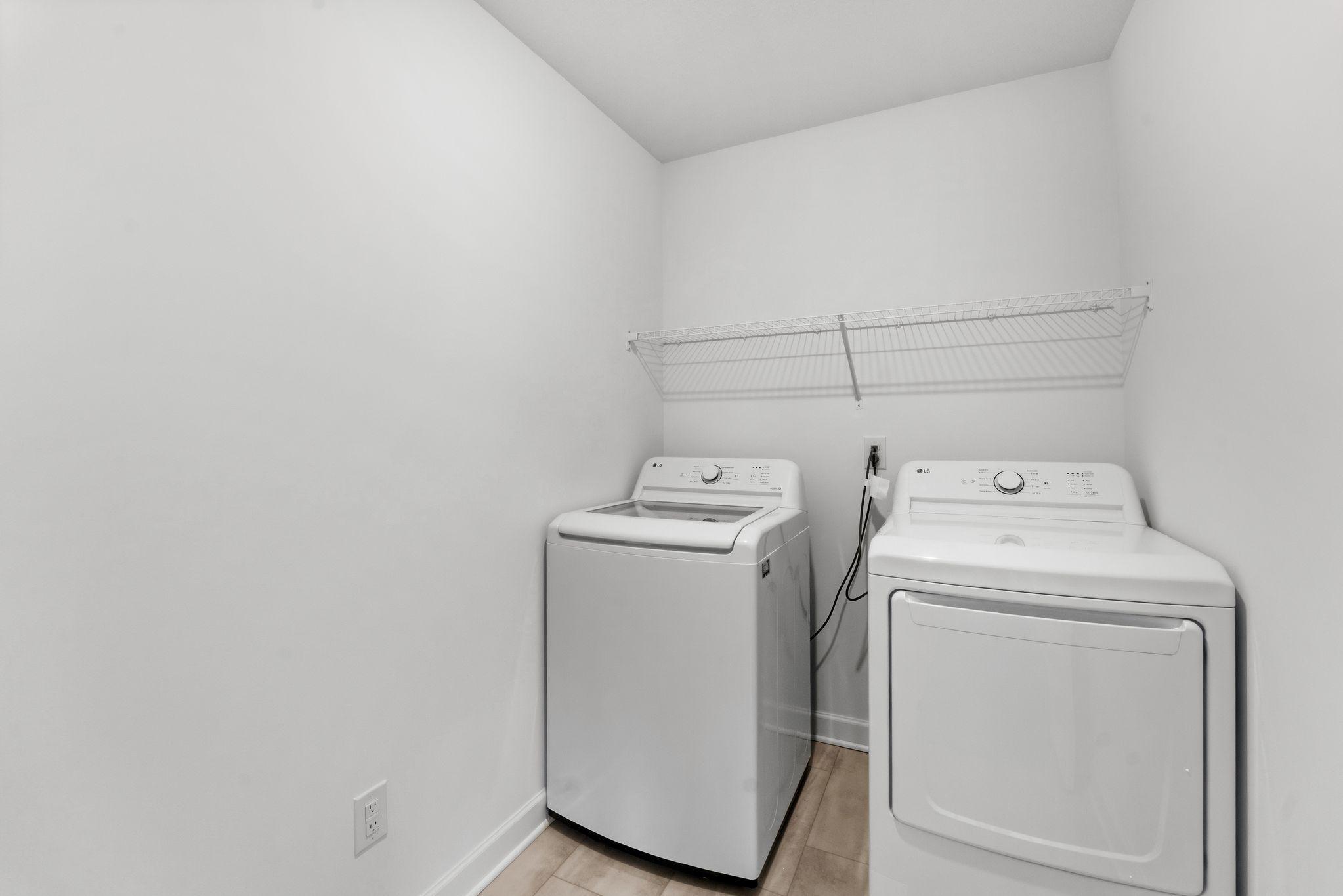 Laundry room with ventilated shelving for all your storage needs.