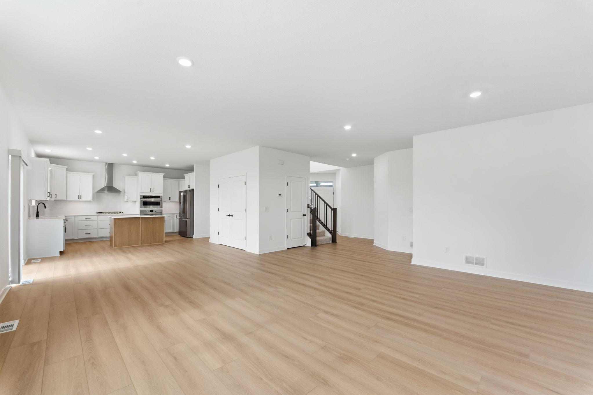 The breakfast room is situated among the open floorplan, allowing for effortless flow between rooms.