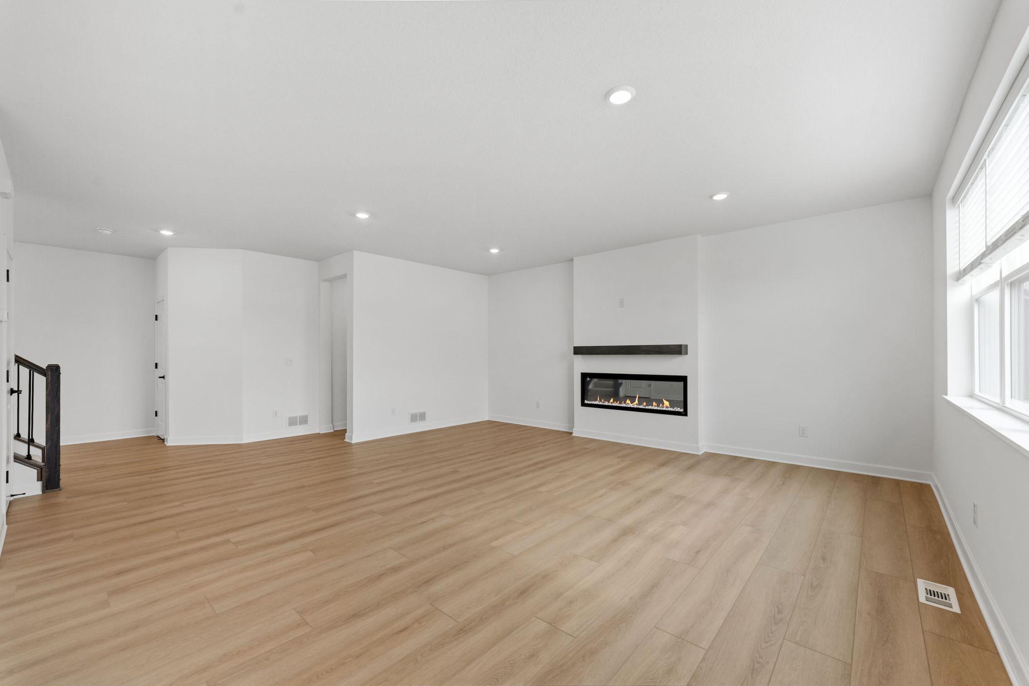 An electric fireplace brings a warm glow to the Great Room