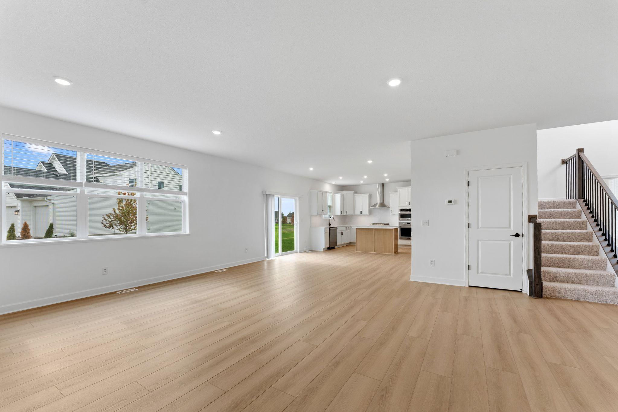 Glass sliders can be open to invite a pleasant breeze throughout the home