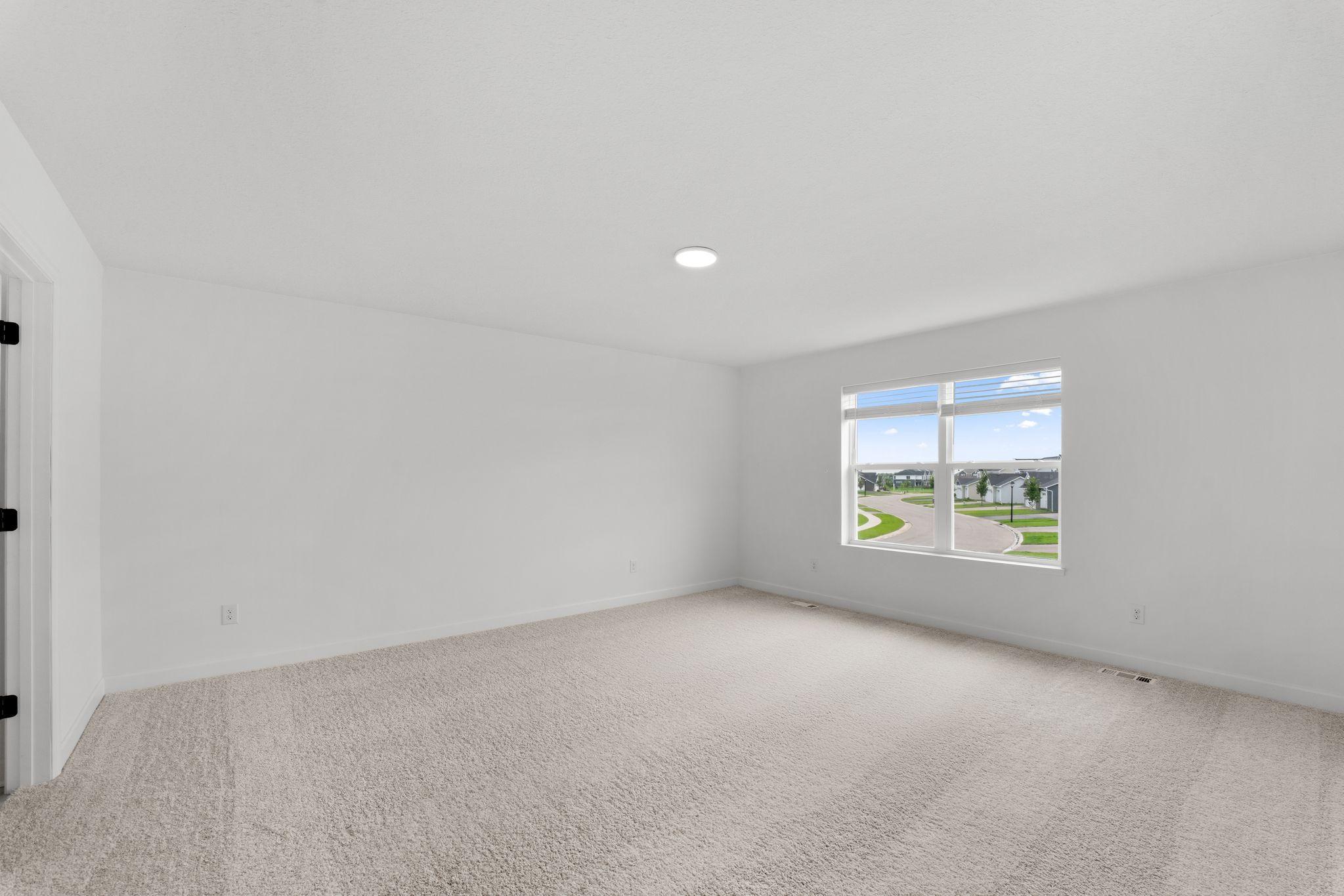 The owner’s suite is located upstairs, complete with a restful bedroom, an en-suite bathroom and a walk-in closet.