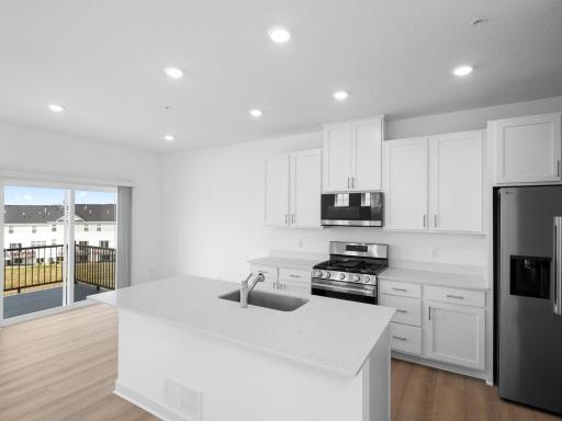 Designed to accommodate modern living, this chef-ready kitchen is fully equipped with a versatile center island and high-end features that allow homeowners to cook, eat and entertain with ease.