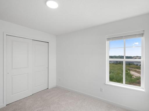 Each secondary bedroom includes a generously sized closet