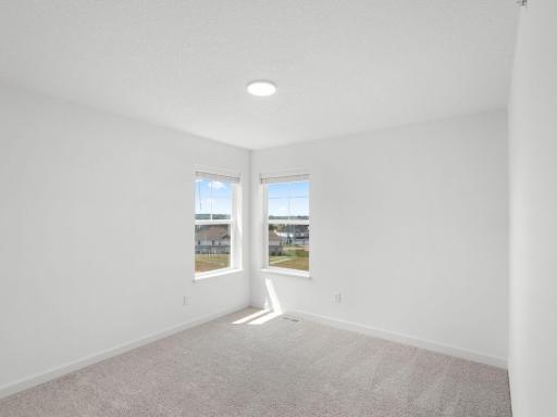 Residing on the upper level are two secondary bedrooms to provide excellent sleeping accommodations to family members.
