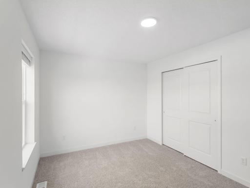 Each secondary bedroom includes a generously sized closet