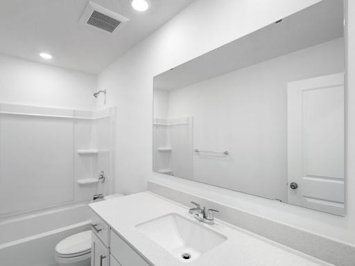 A full-sized bathroom on the second level optimizes the space for residents, offering a large vanity and a handy shower and tub combination.