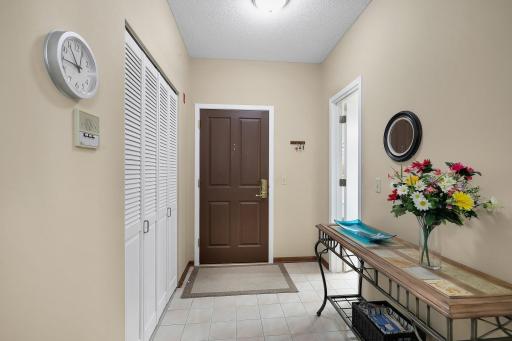 Spacious front foyer with walk-in closet for coats, shows, and additional storage.