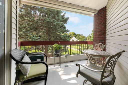This is your private view of the walkway, lake, and outdoor amphitheater. You can enjoy listening to the music and entertainment right on your covered balcony!