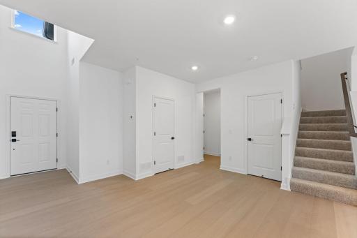 (Photo of a similar home, actual finishes may vary) The open concept floorplan allows for ease of access to all main level living spaces