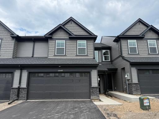 Welcome to 10549 Harbor Ln N! (Photo is of the actual home.)