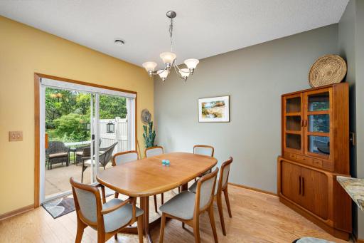 The dining area is next to the kitchen and serving counter and there is a walk out to the rear patio!