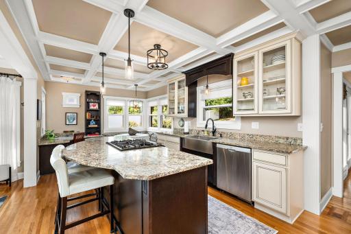 Impressive kitchen with center island and coffered ceiling!