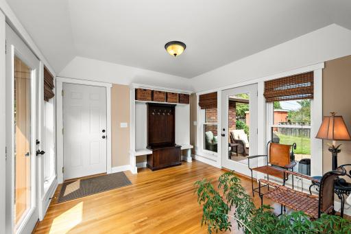 The large mudroom offers coats and shoes space, and connection to the garage and to the side and back decks!