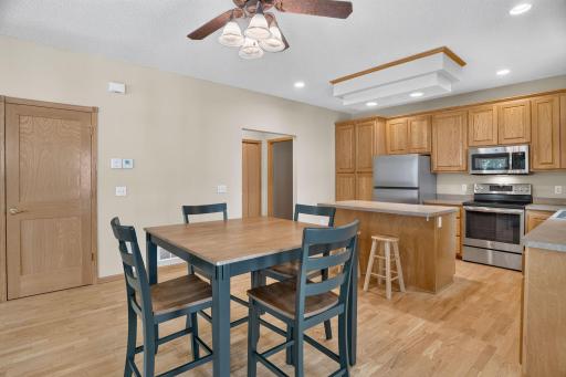 Dining, Kitchen, Door to Basement, Hallway to 1/2 Bath and Garage
