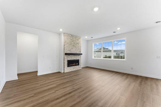 Wide windows bathe the space in natural light on sunny days